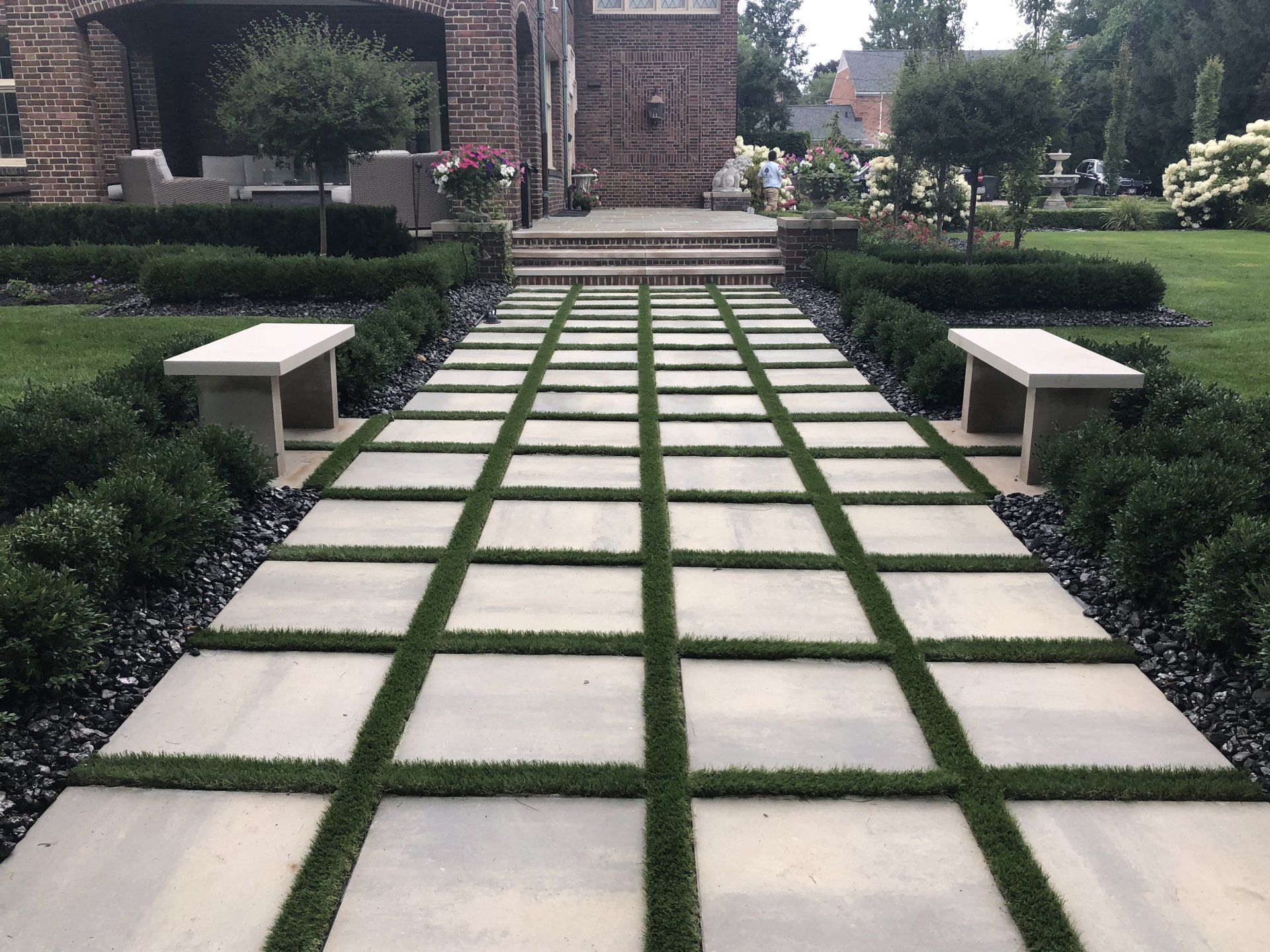 a brick house with a walkway leading to it