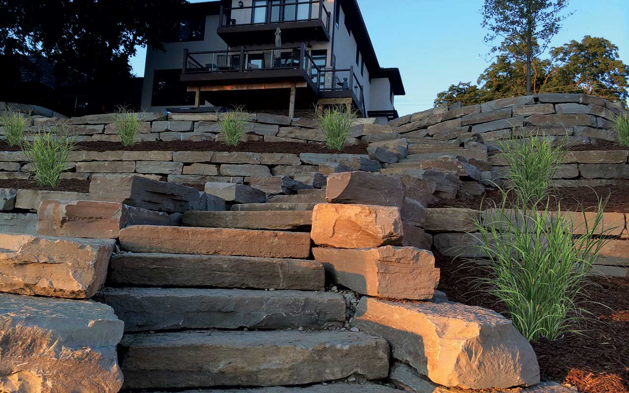 a stone staircase leading up to a house on a hill .
