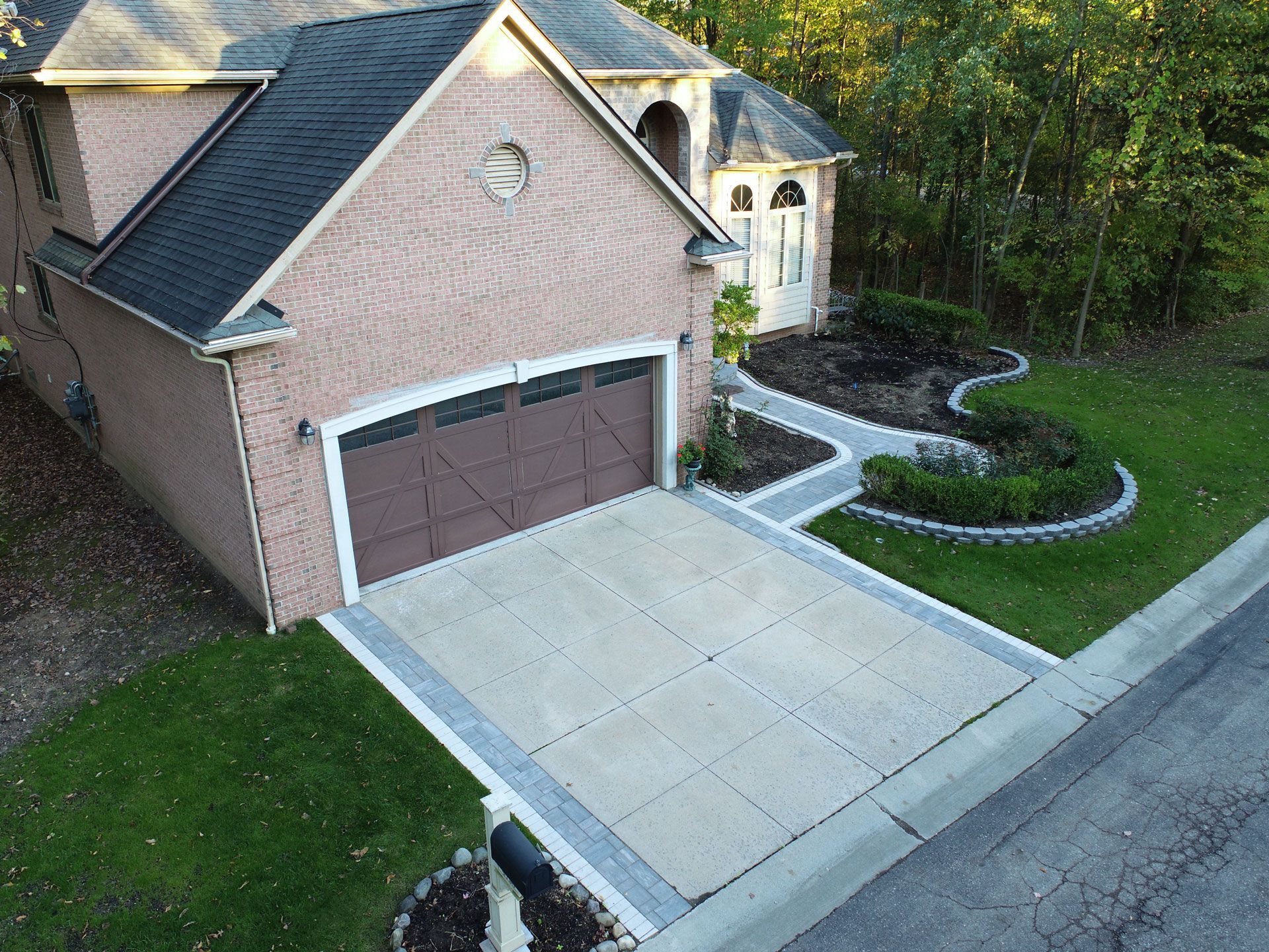A white house with a basketball hoop in front of it