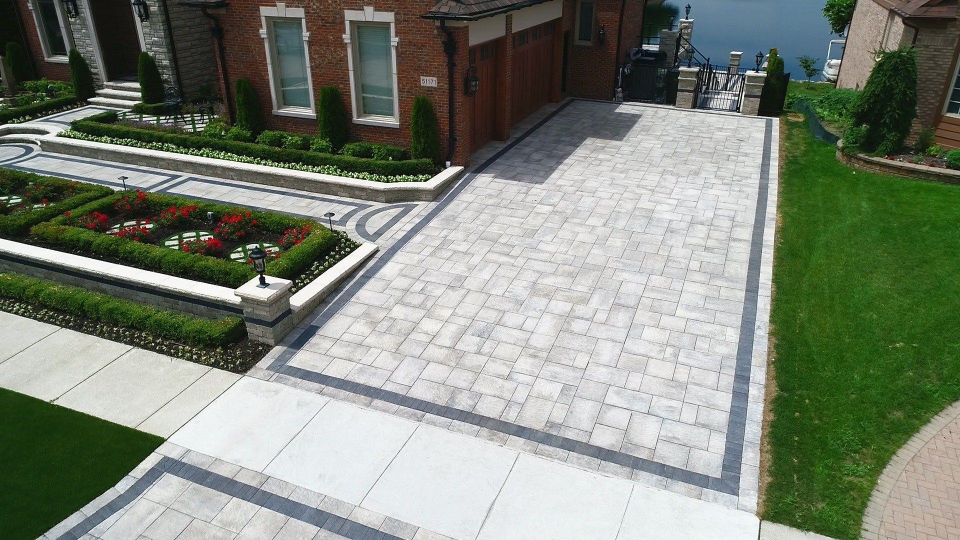 An aerial view of a driveway leading to a house.