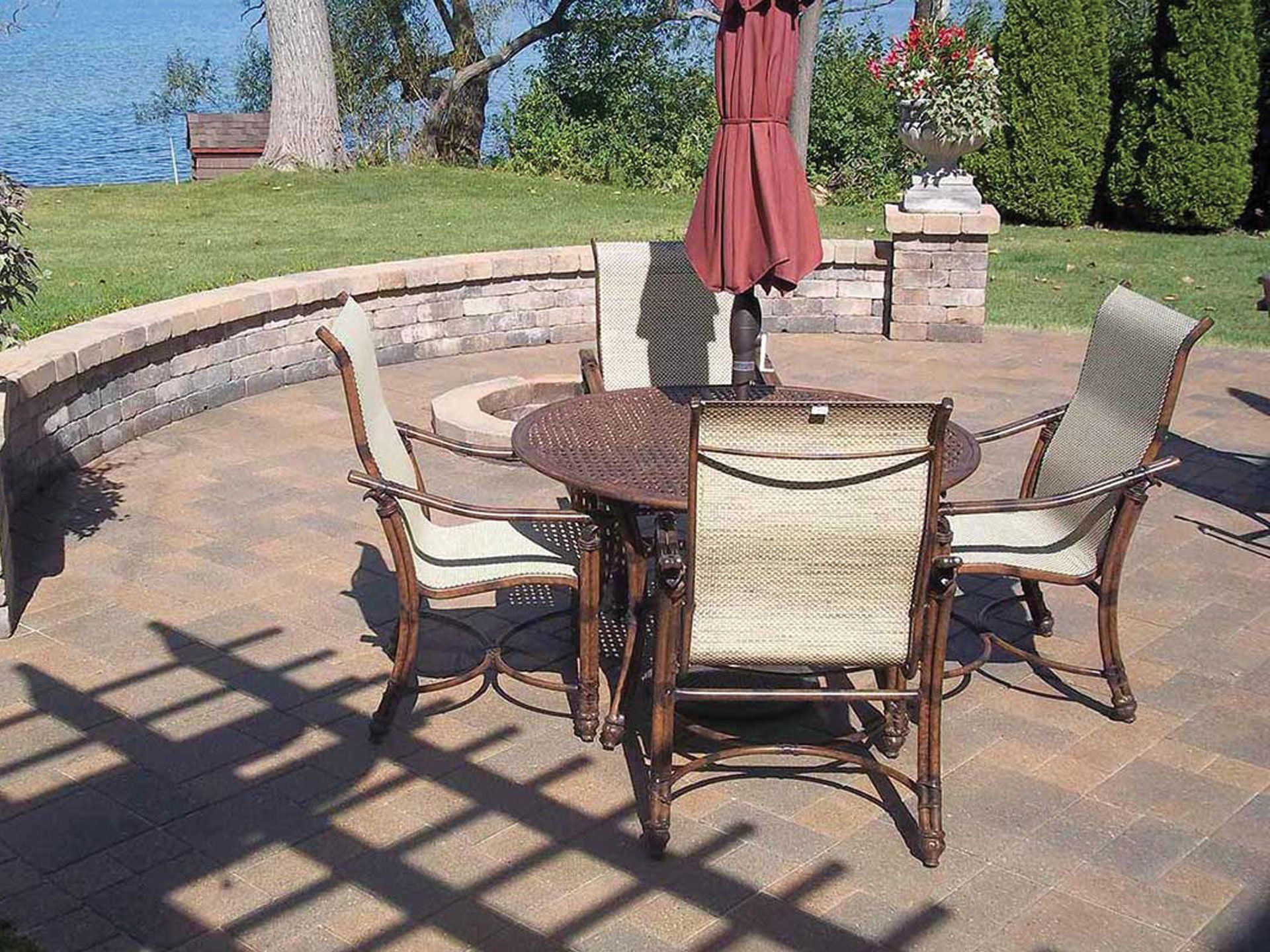 a patio with a table and chairs and an umbrella