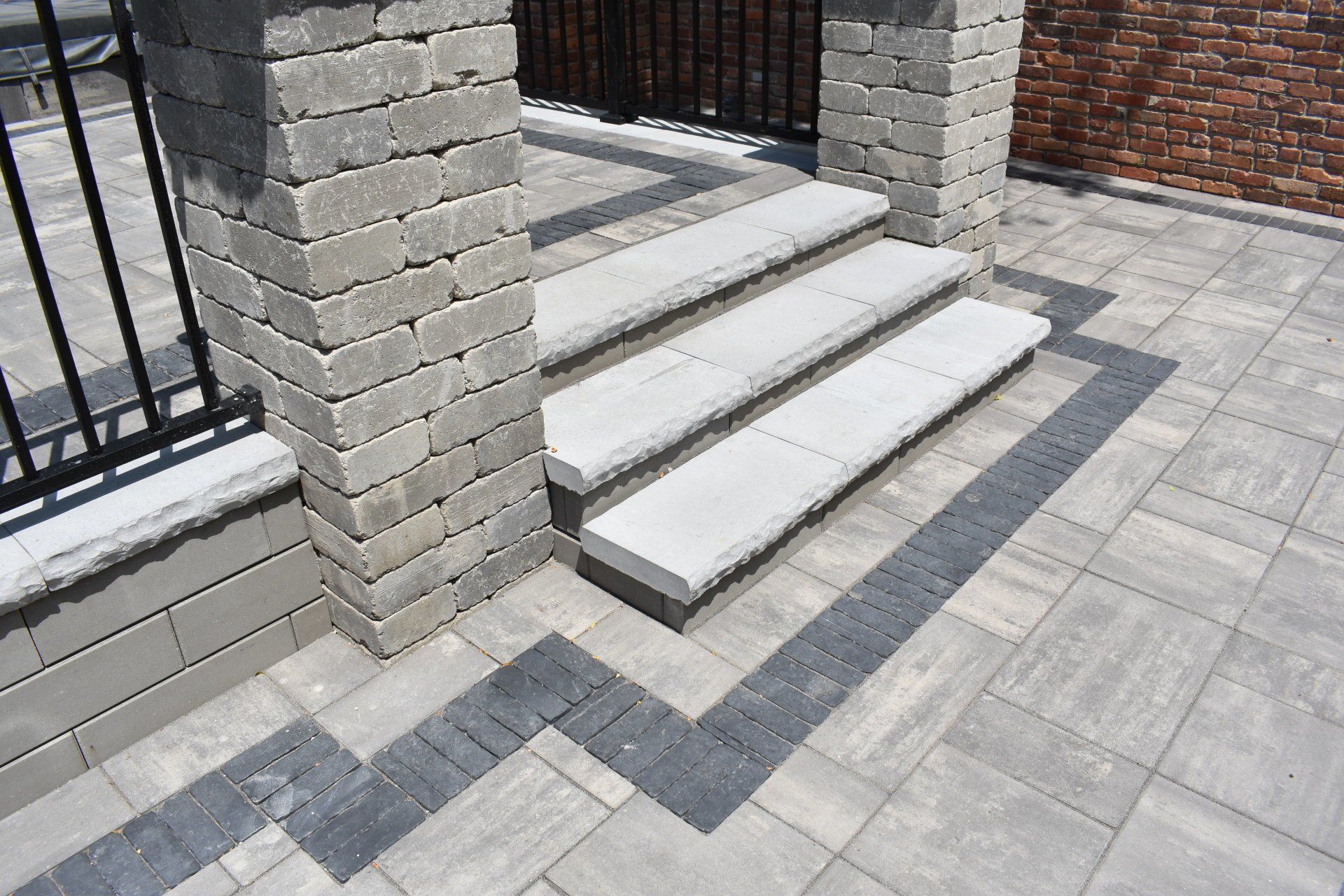 A set of stairs leading up to a brick building.