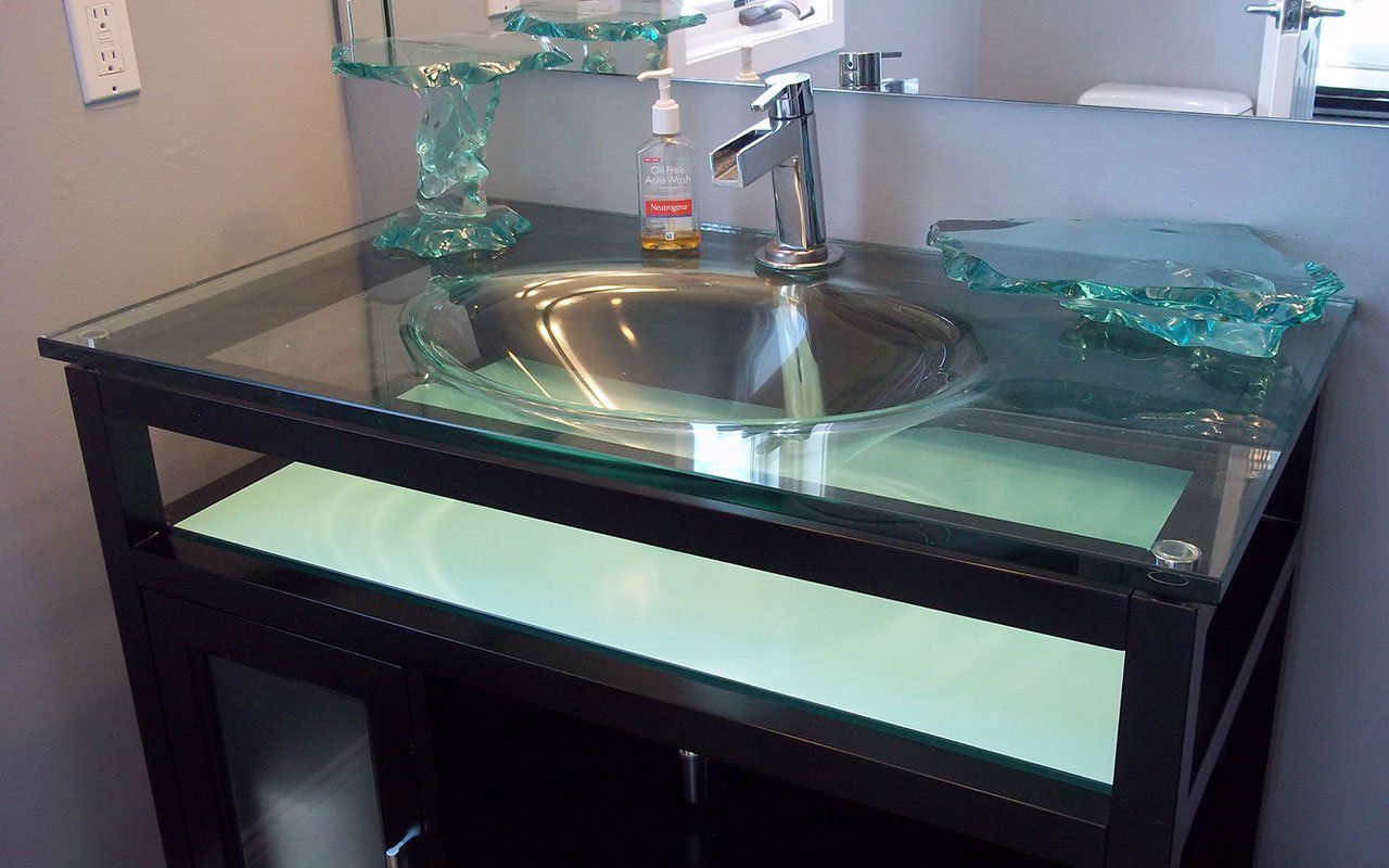 A bathroom vanity with a sink and a mirror