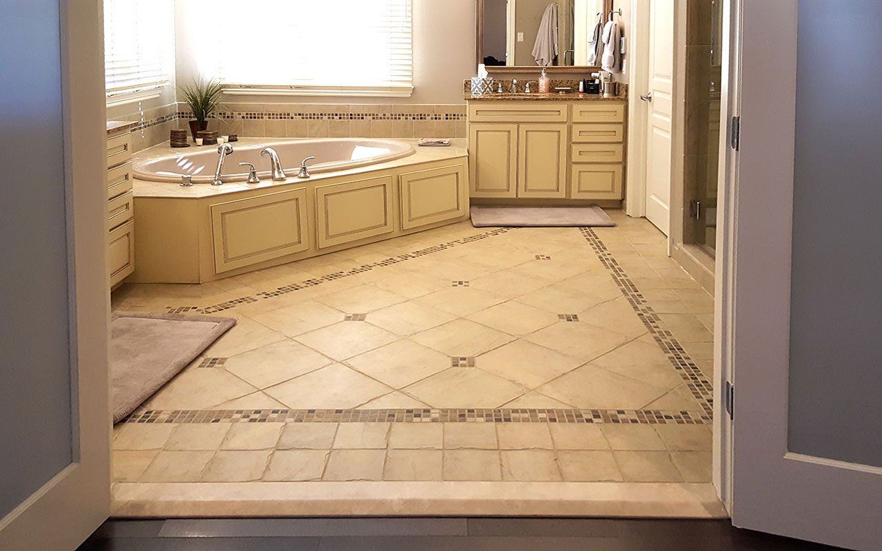 A bathroom with a bathtub and two sinks