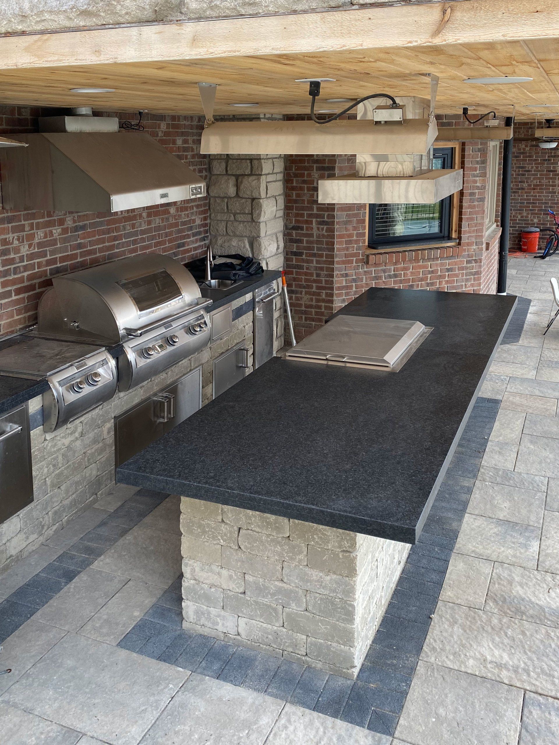 a kitchen with a large island and a grill .