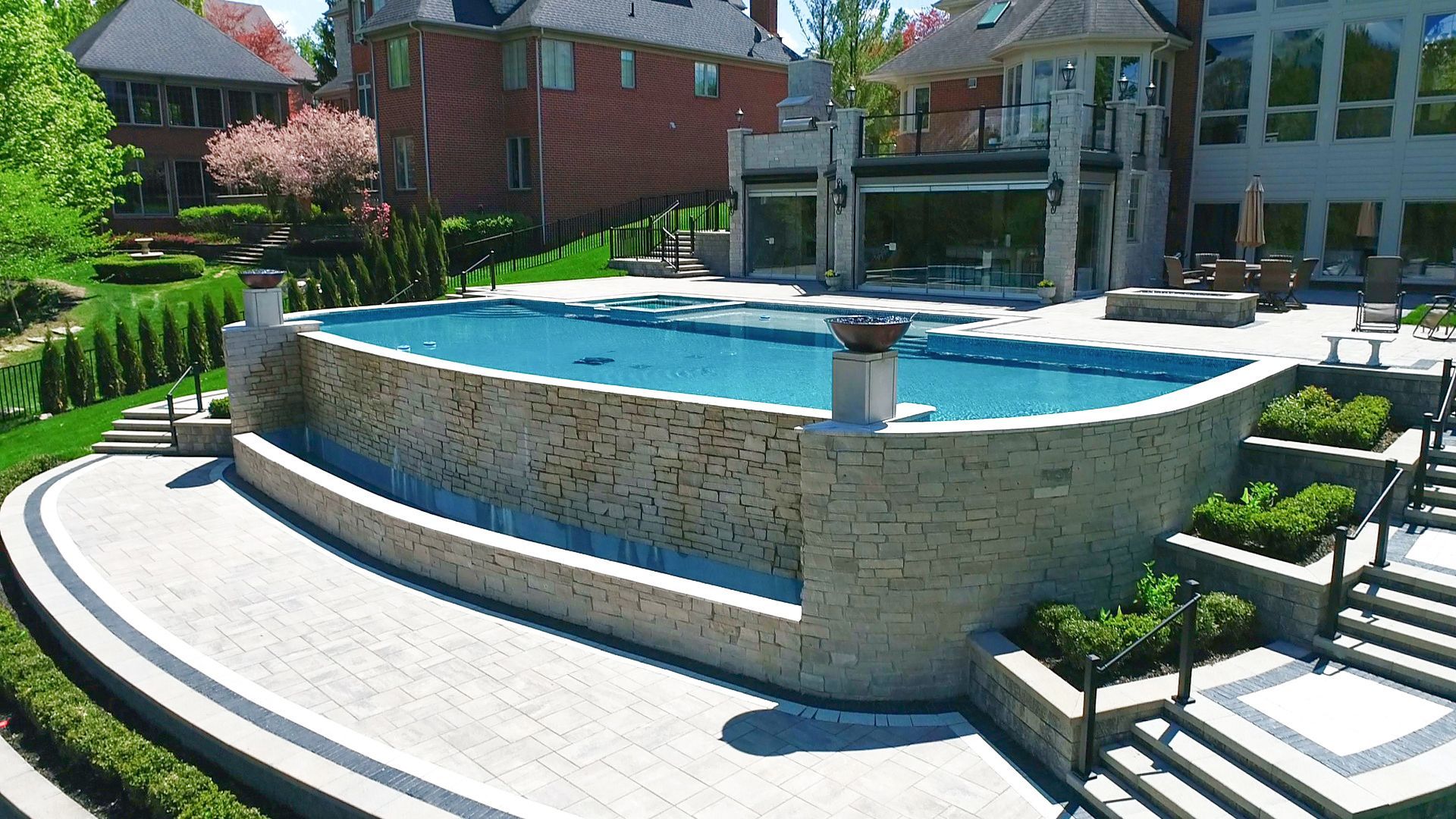 a large swimming pool in the backyard of a house