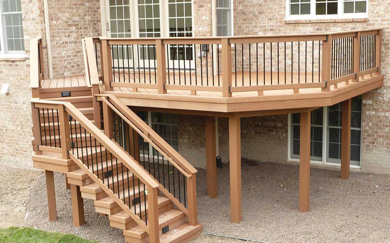 a wooden deck with stairs leading up to it