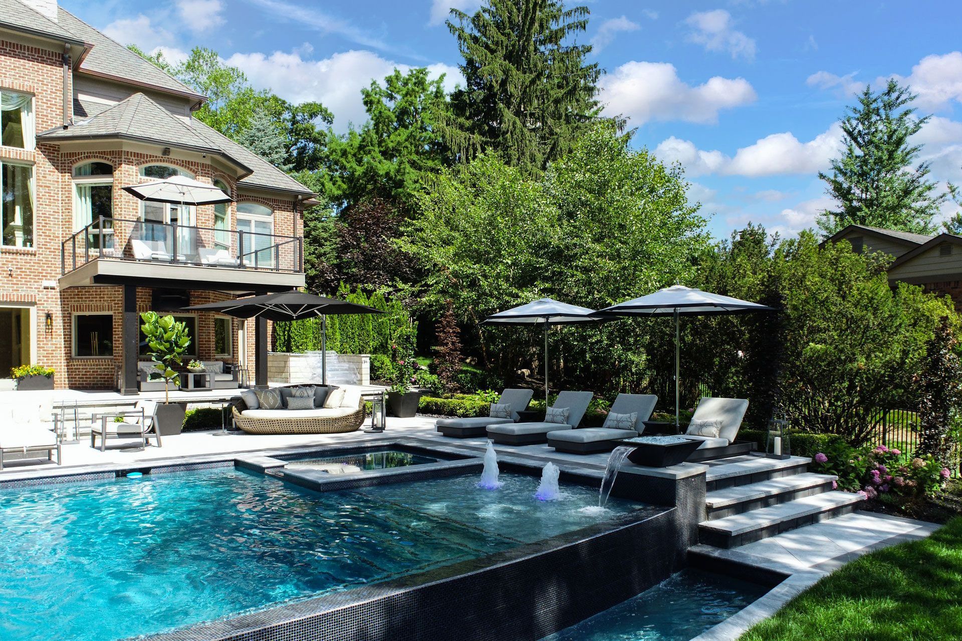 a large swimming pool in the backyard of a house