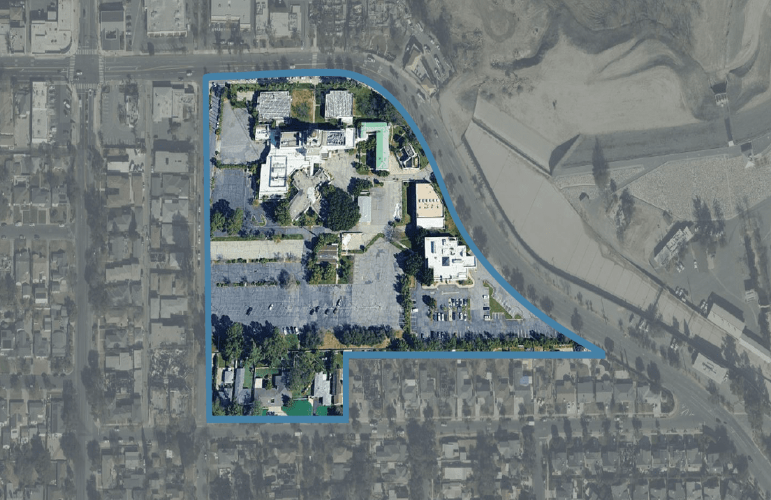 An aerial view of a residential area with a blue outline