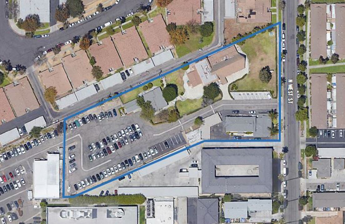 An aerial view of a residential area with a blue line.
