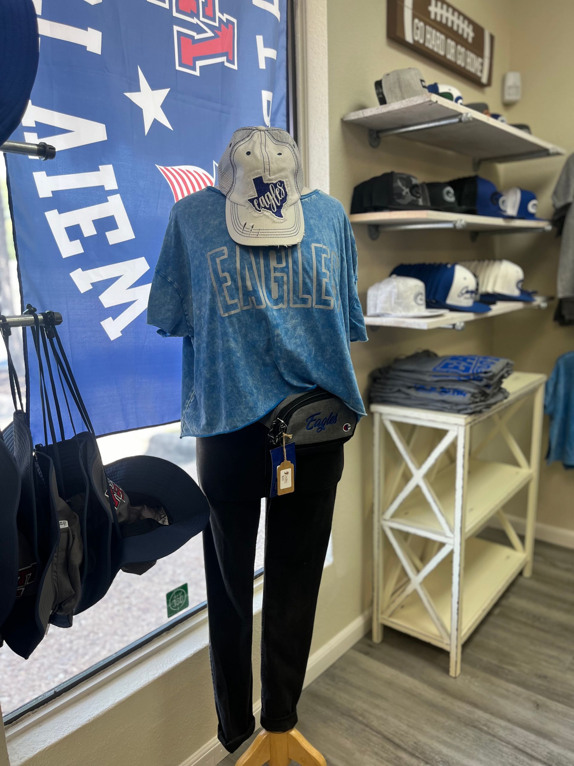 A mannequin is wearing a blue eagles shirt.