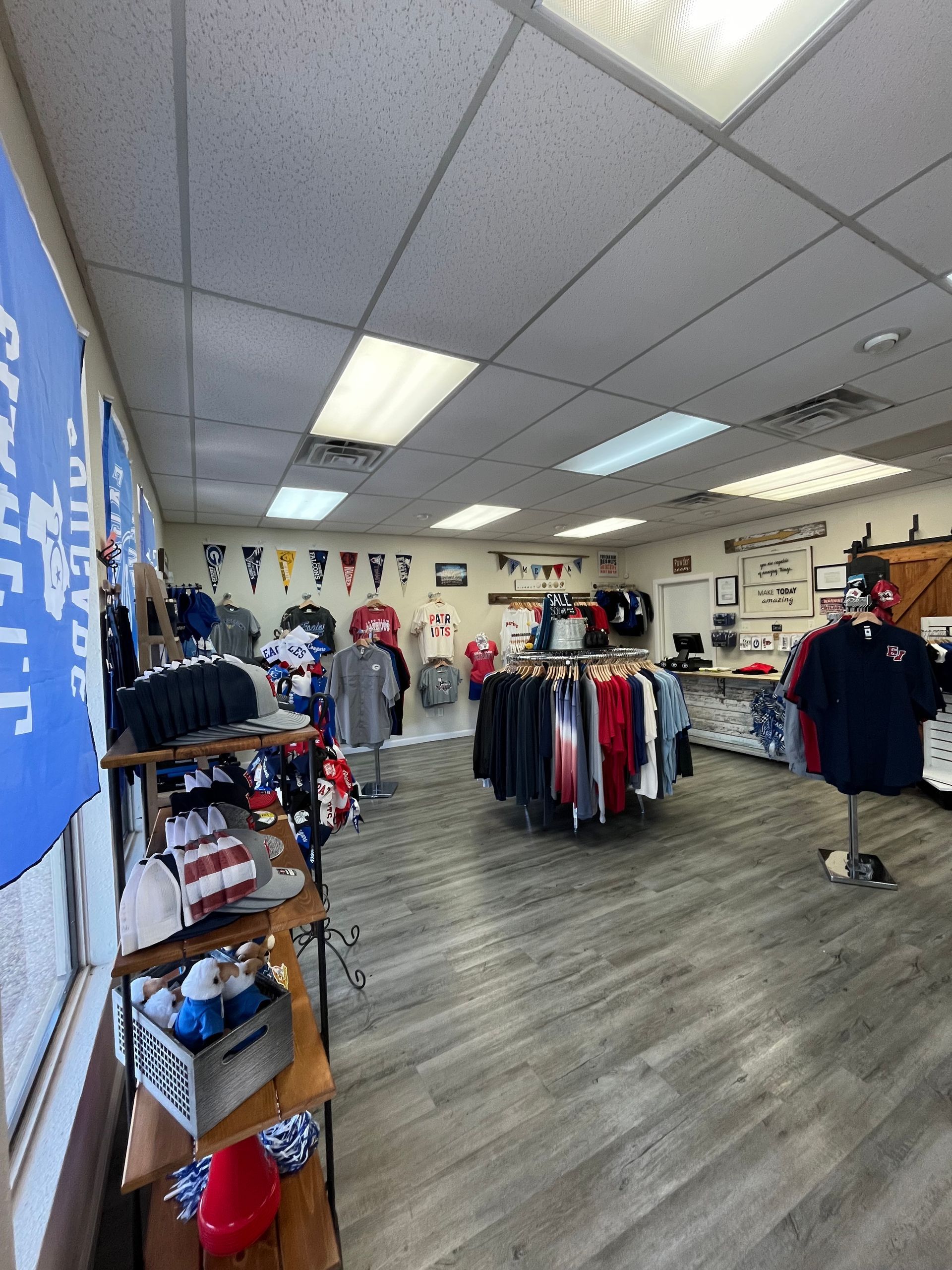 A store filled with lots of clothes and flags.