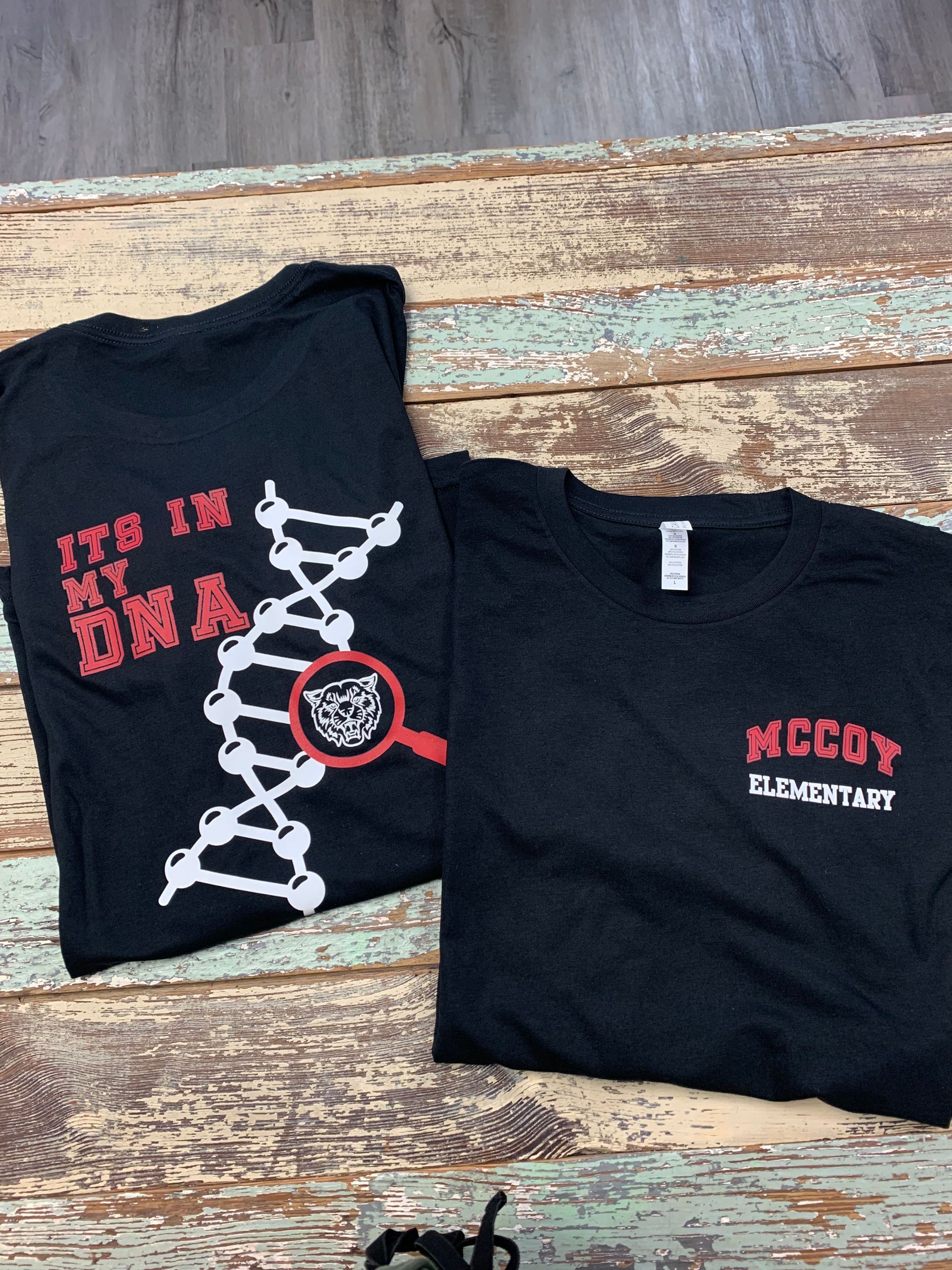 A black t-shirt that says it 's in my DNA.