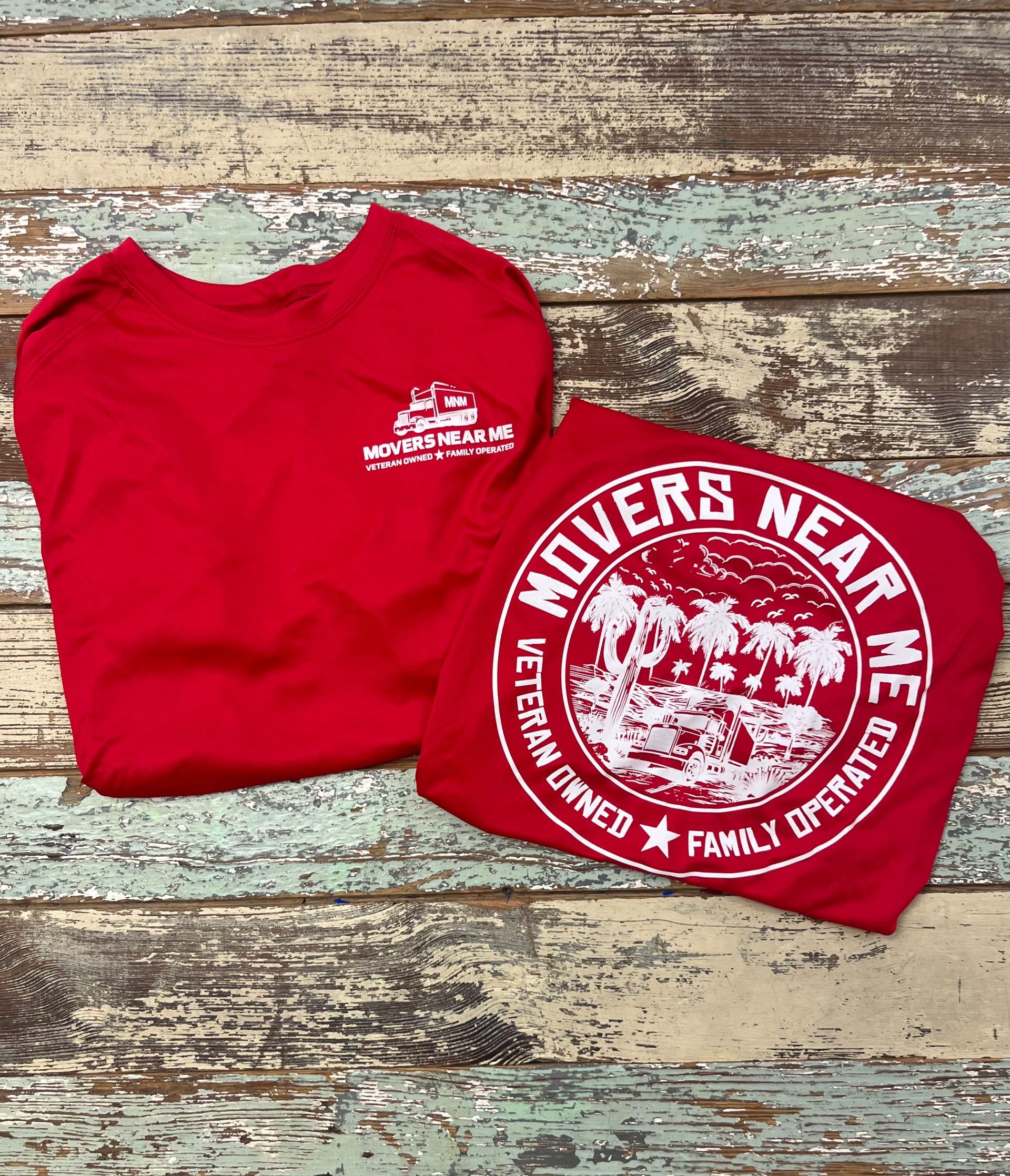 A red t-shirt that says ' movers near me ' on it.