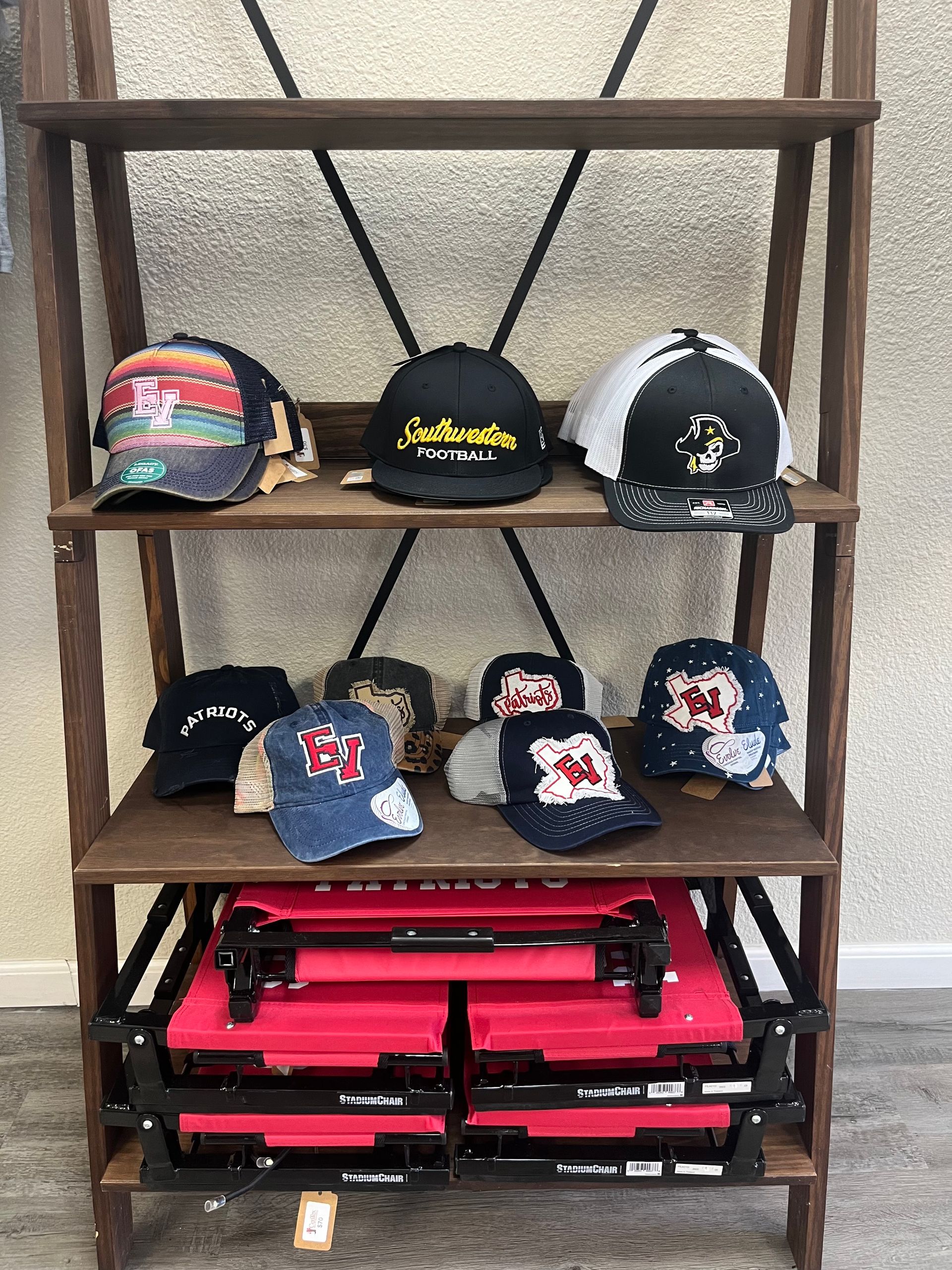 A shelf filled with lots of hats and boxes.