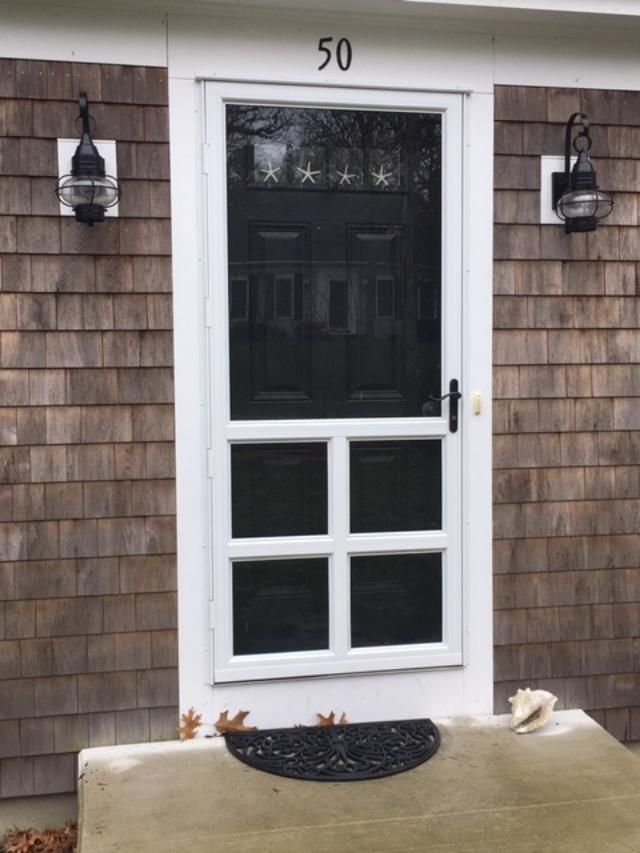 a white screen door with the number 50 on it