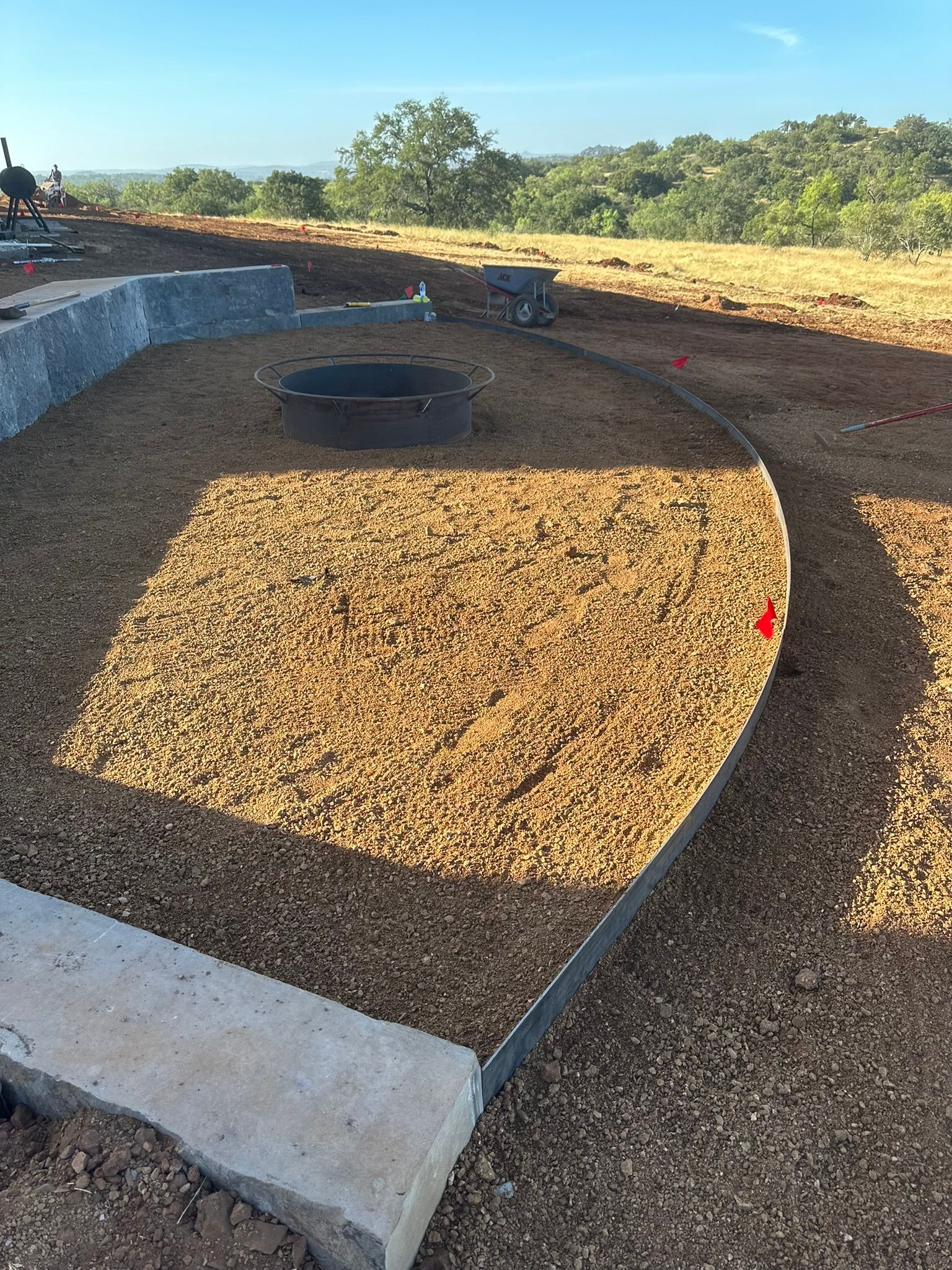 A large pile of mulch is sitting in the middle of a field.