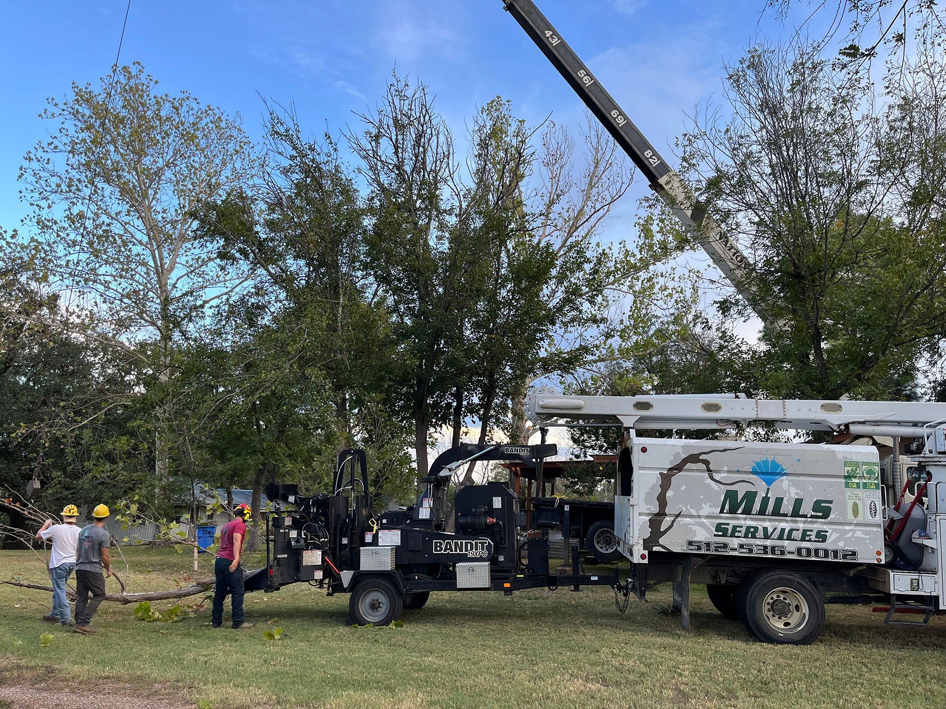 A mills services truck is parked in a grassy field.