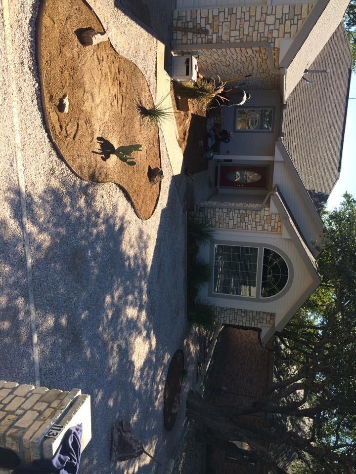 A house with a patio and a lawn in front of it