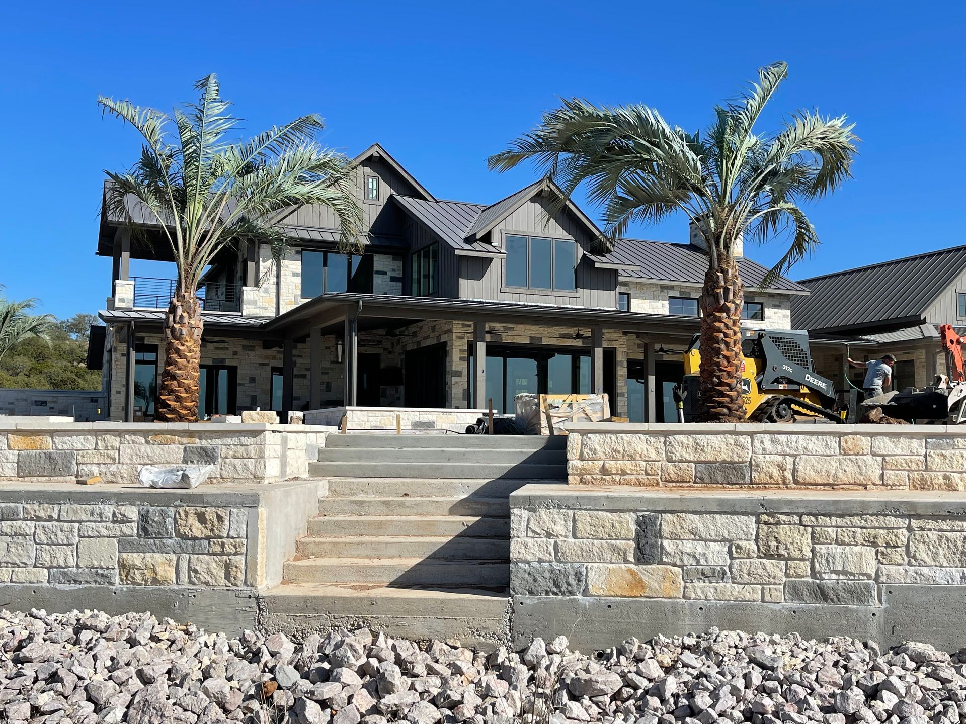 A large house with palm trees in front of it