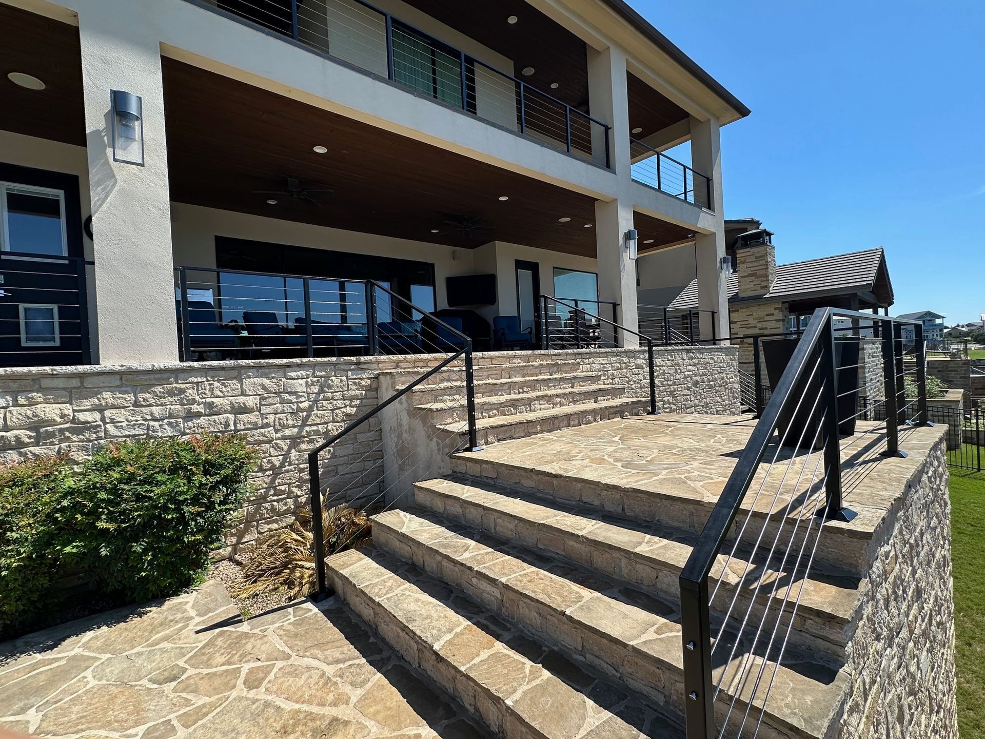 A large house with stairs leading up to the second floor.
