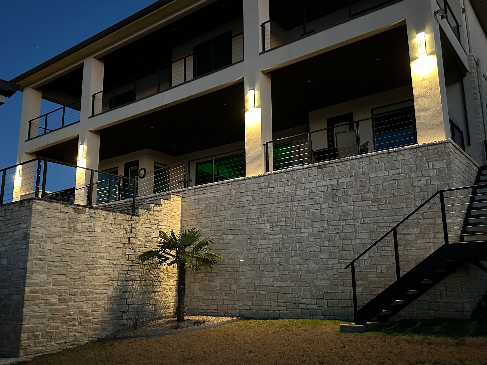 A large house with stairs leading up to it