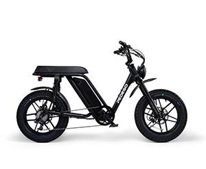 A black electric scooter is sitting on a white surface.