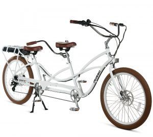 A white tandem bicycle with brown tires on a white background