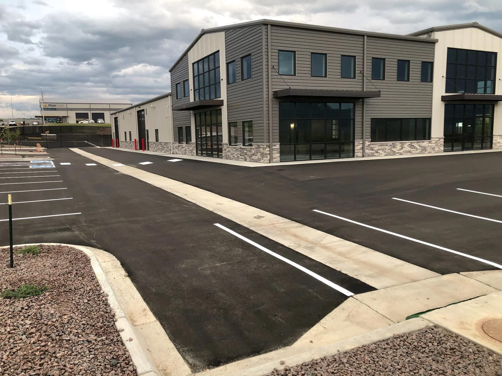 A large building with a parking lot in front of it.