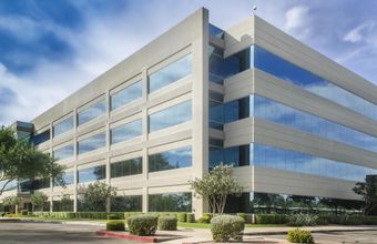 A large office building with a lot of windows
