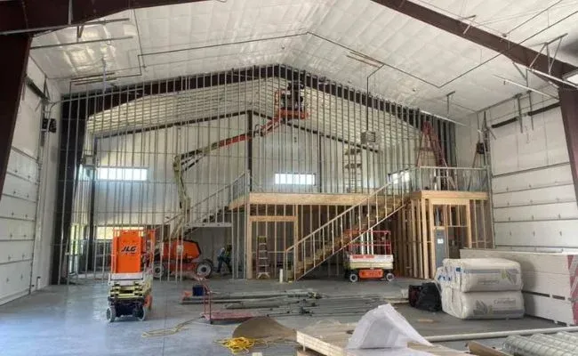 A large building is being built with a staircase.
