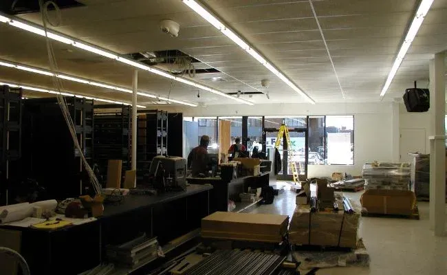 A large room with a lot of lights on the ceiling