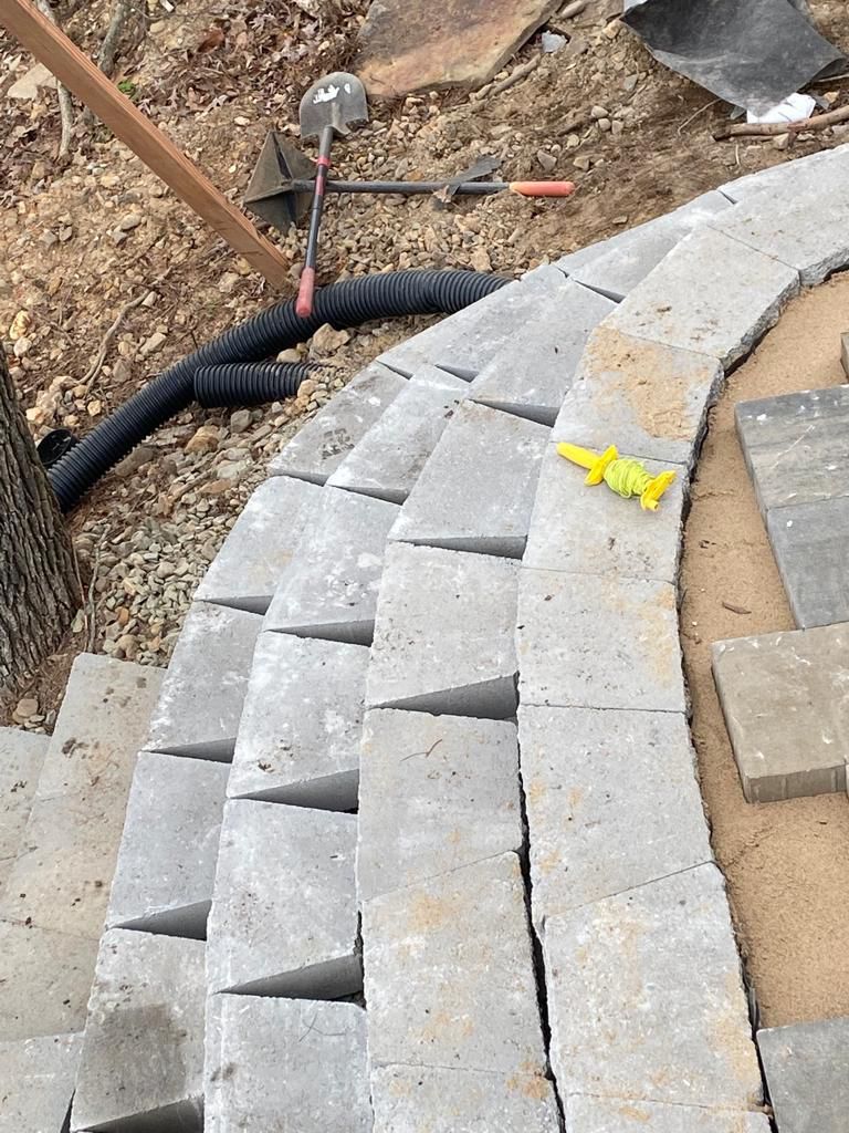 A yellow toy is laying on top of a concrete staircase.