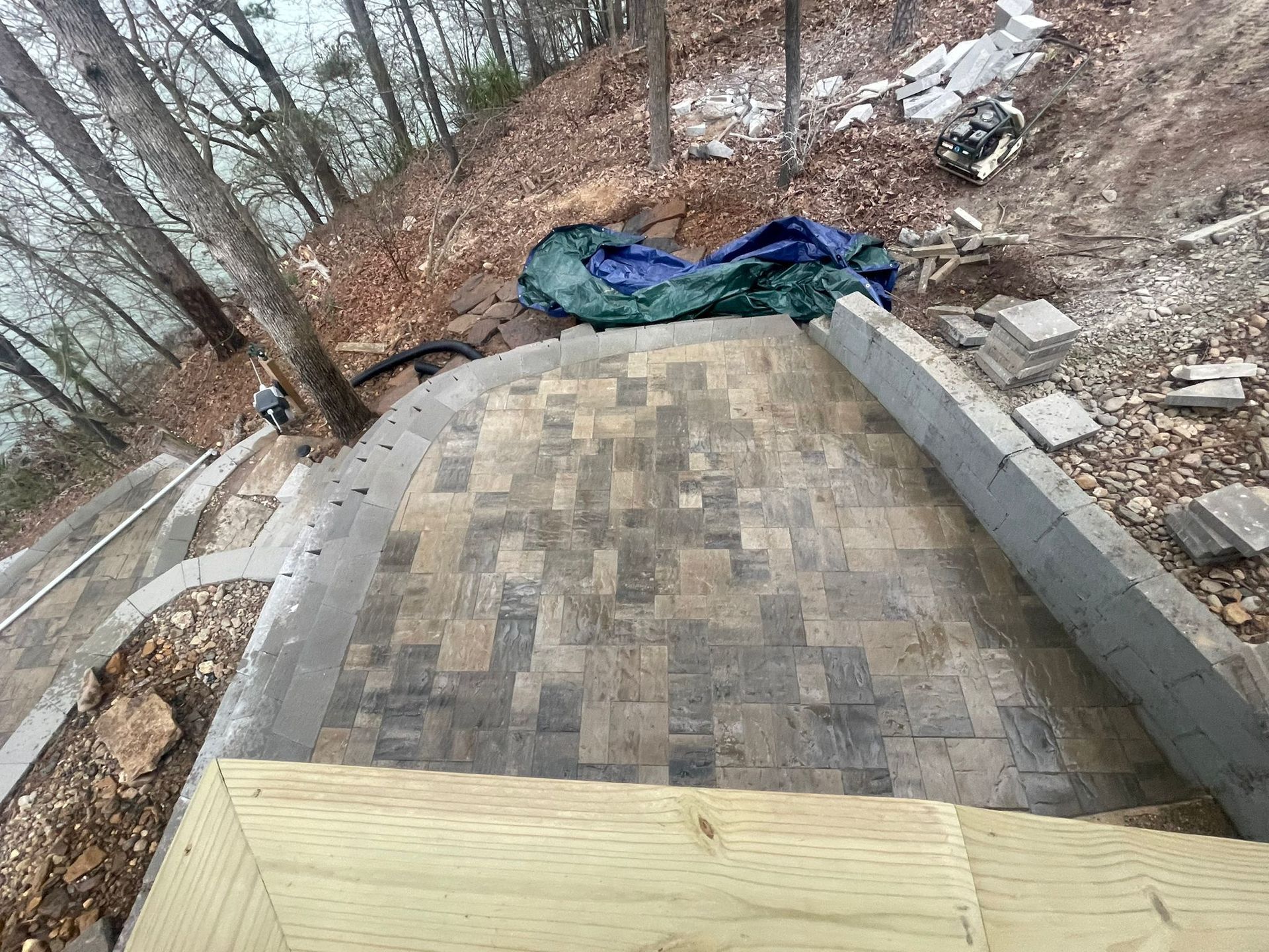A set of stairs leading up to a lake in the woods.