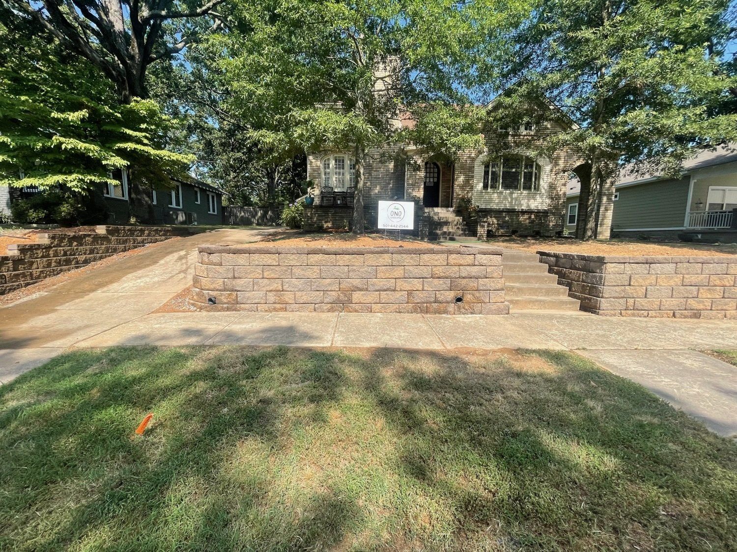 A house with a brick walkway in front of it.