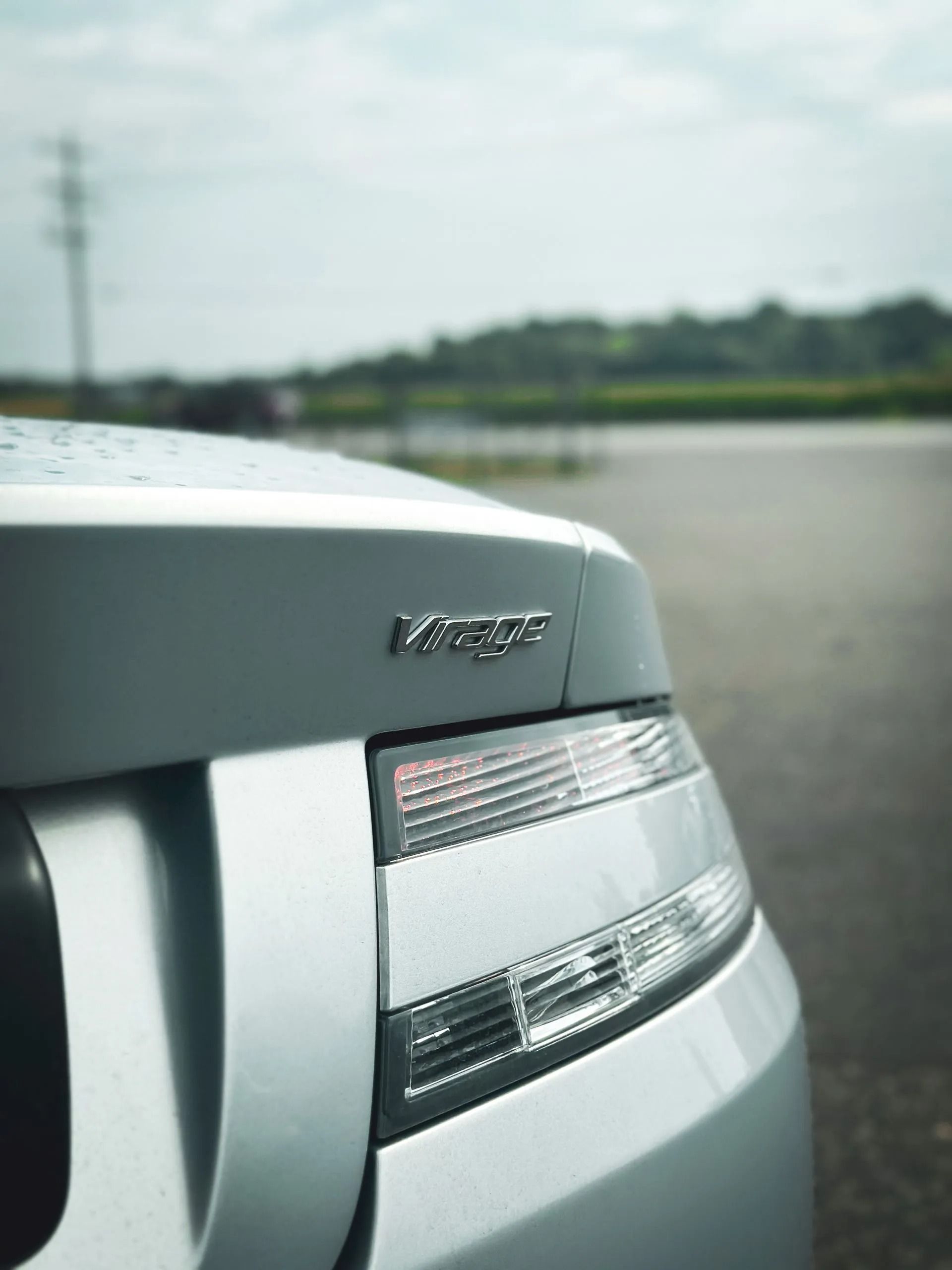 Silver car's rear end with taillight and 