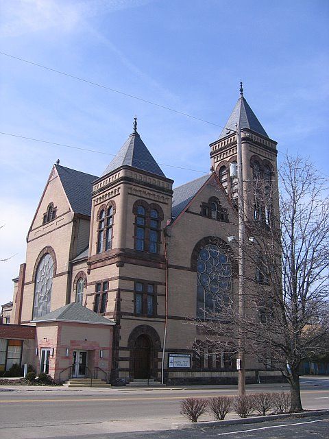 A large brick building with a tower on top of it