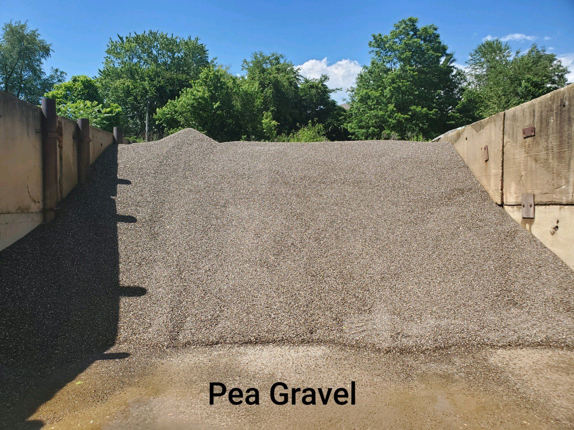 A pile of pea gravel is sitting on the ground
