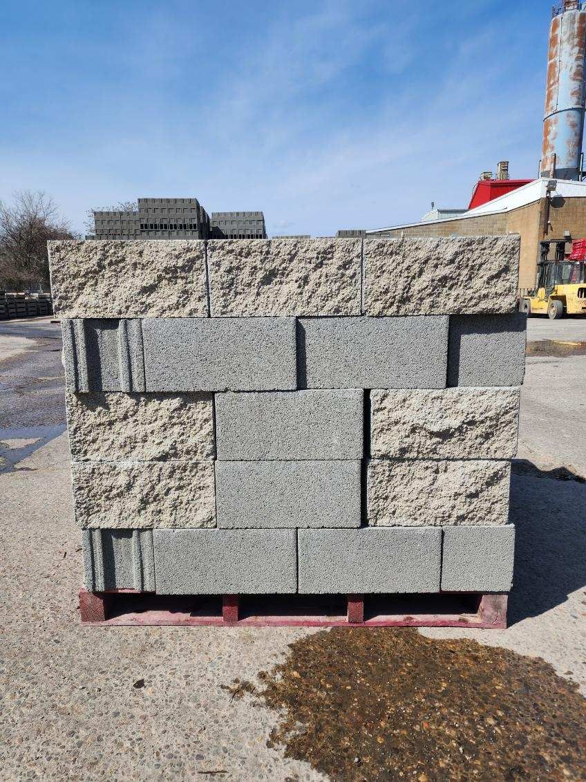 A pile of concrete blocks sitting on top of a wooden pallet.