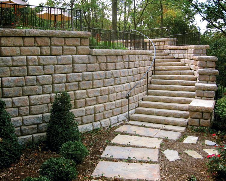 A stone wall with stairs leading up to it