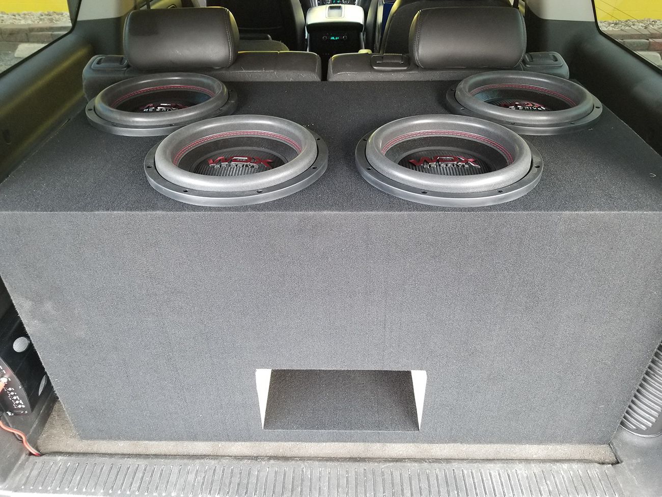 A subwoofer box in the back of a car