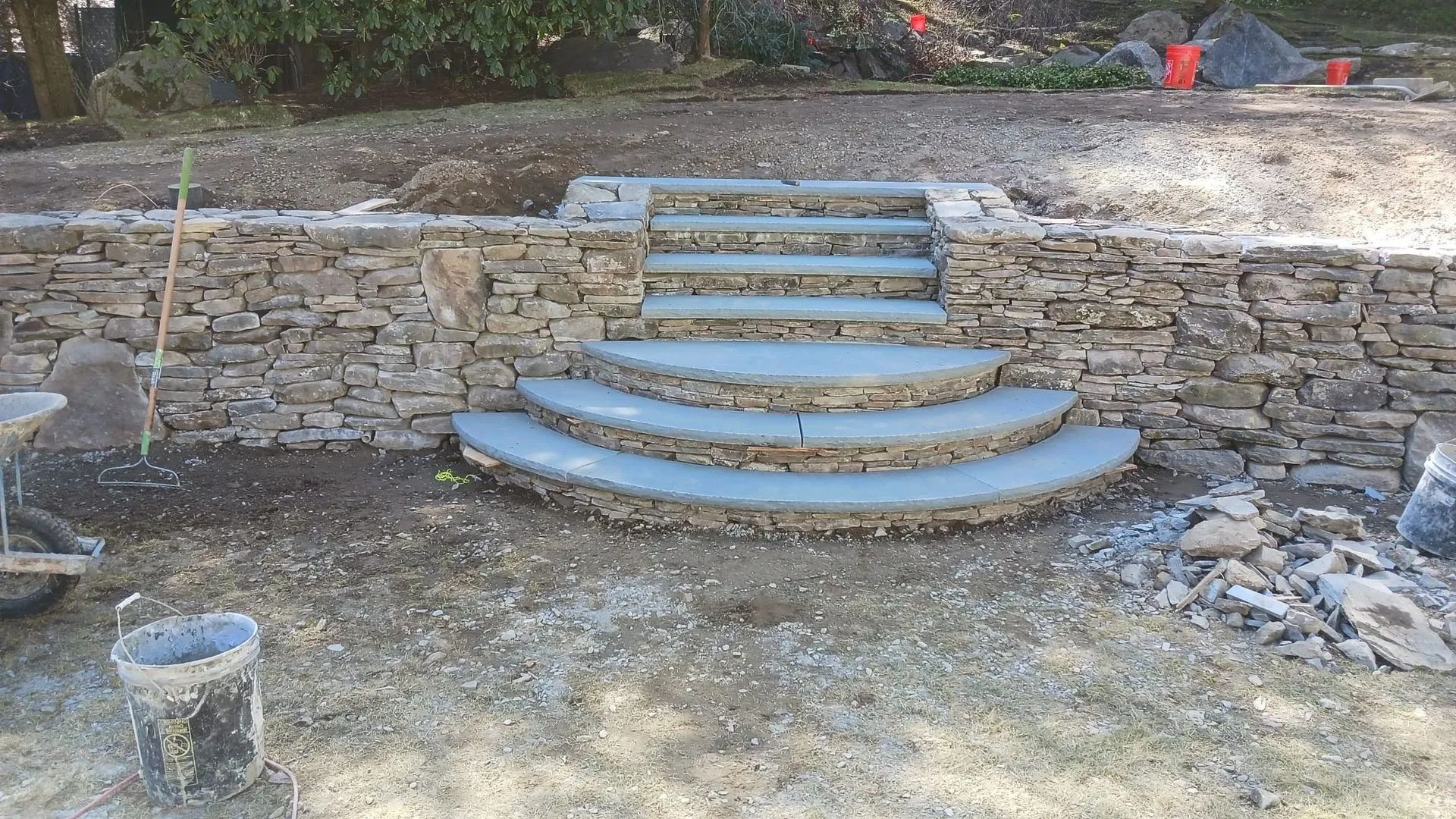 A stone wall with stairs built into it