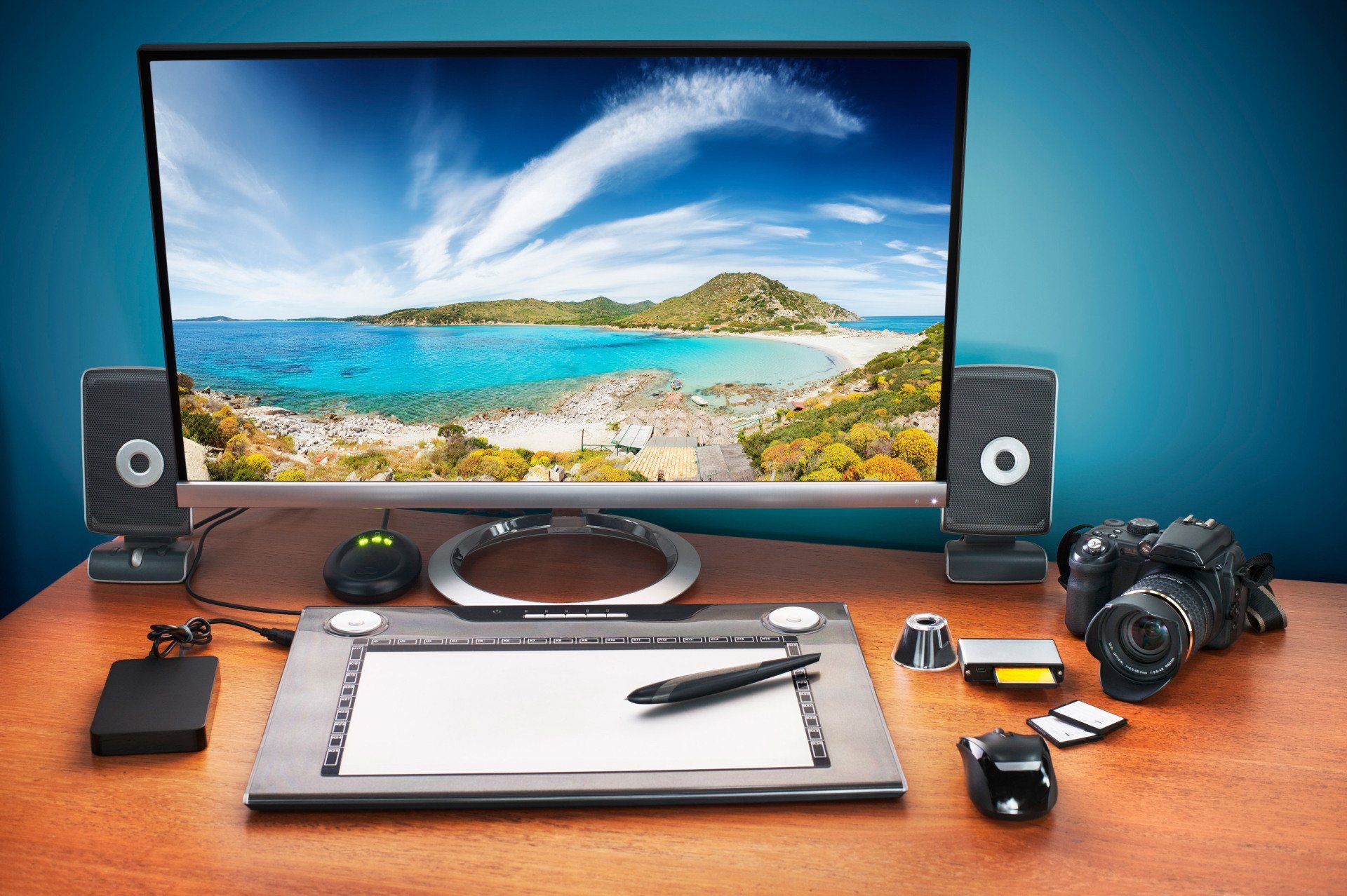 dell computer with sketch pad and camera on desk