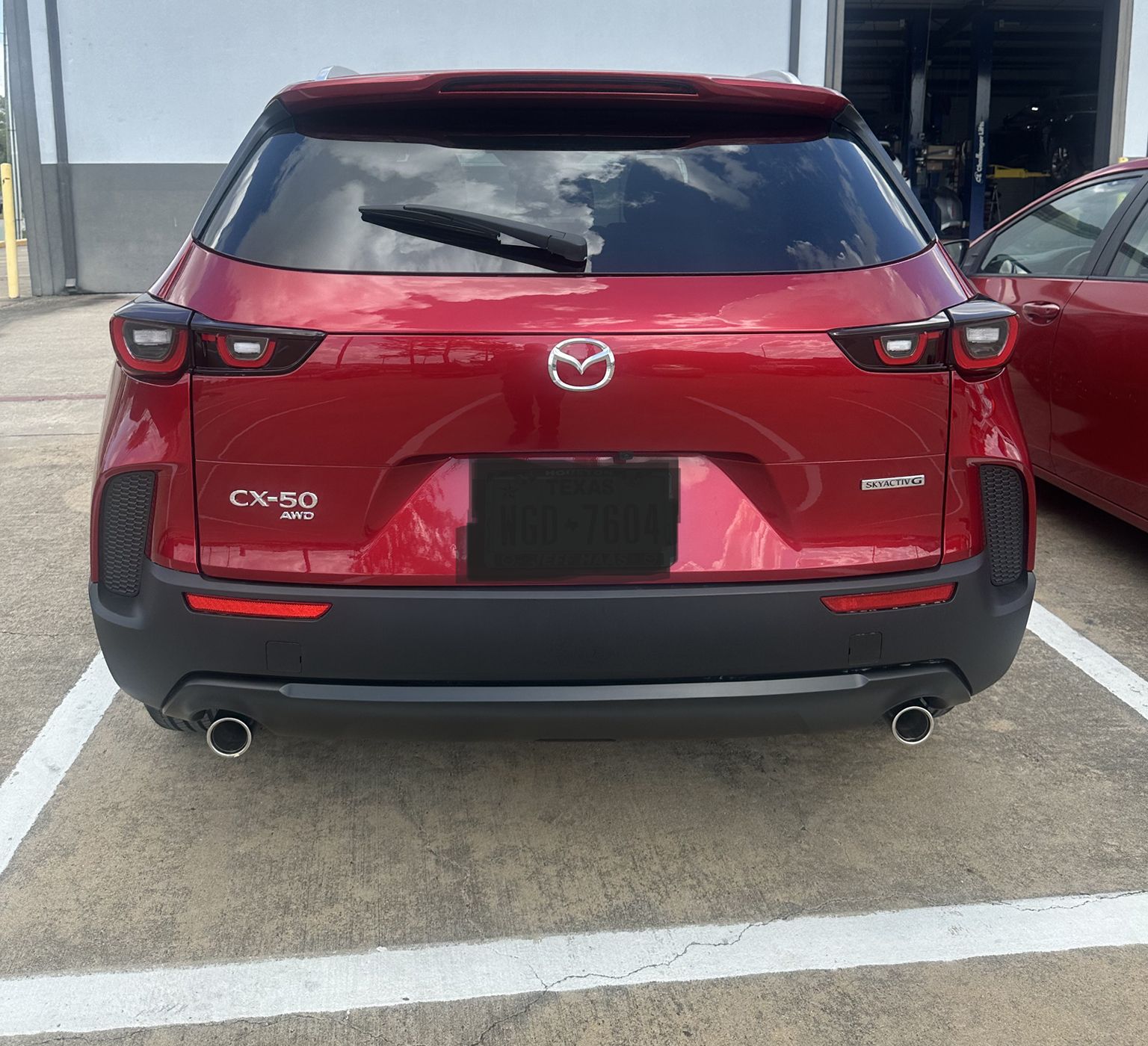 Mazda red car damage repair - after