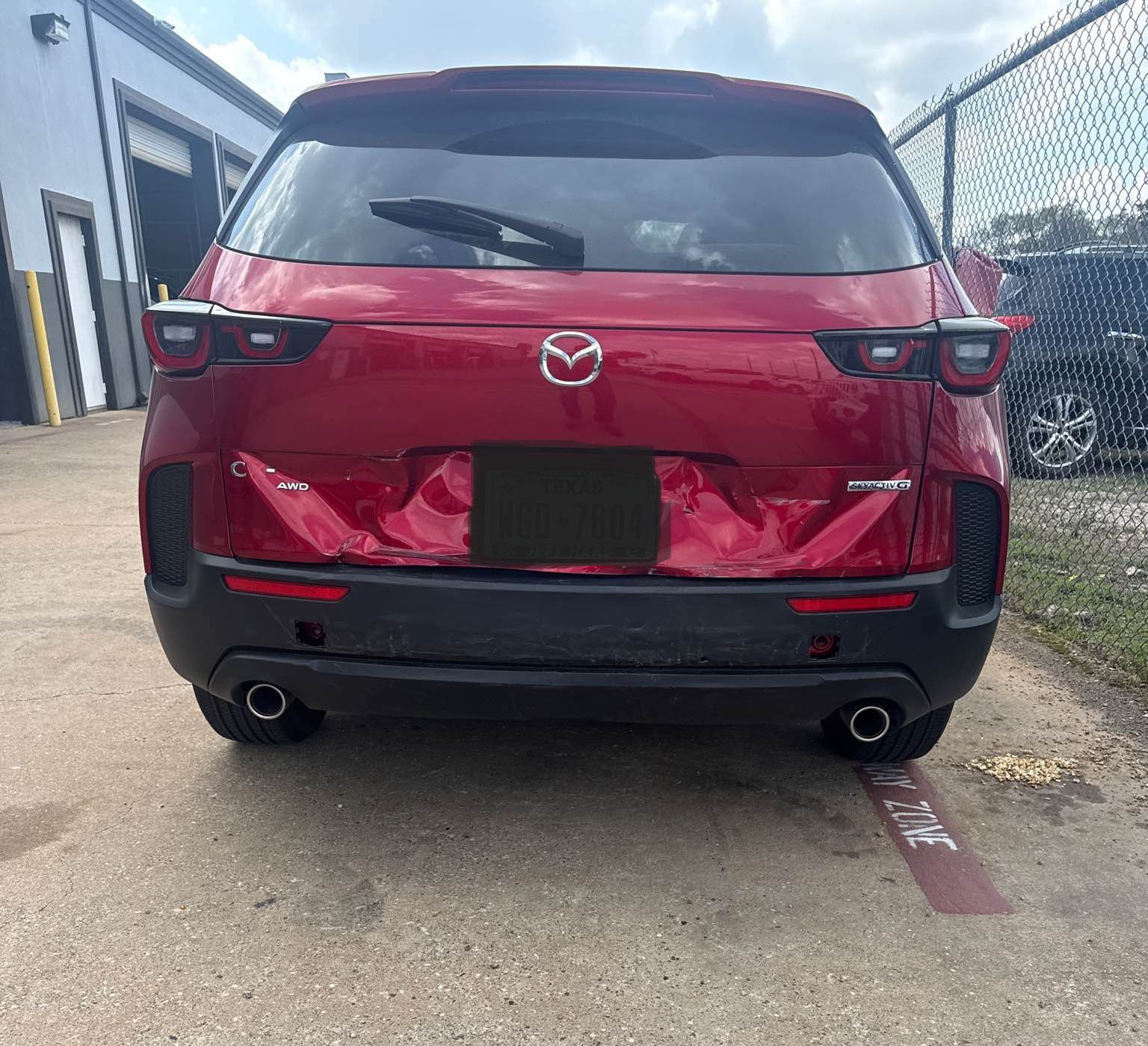 Mazda red car damage repair - before
