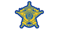 The yellow and blue star-shaped badge of the Sheriffs' Association of Texas.