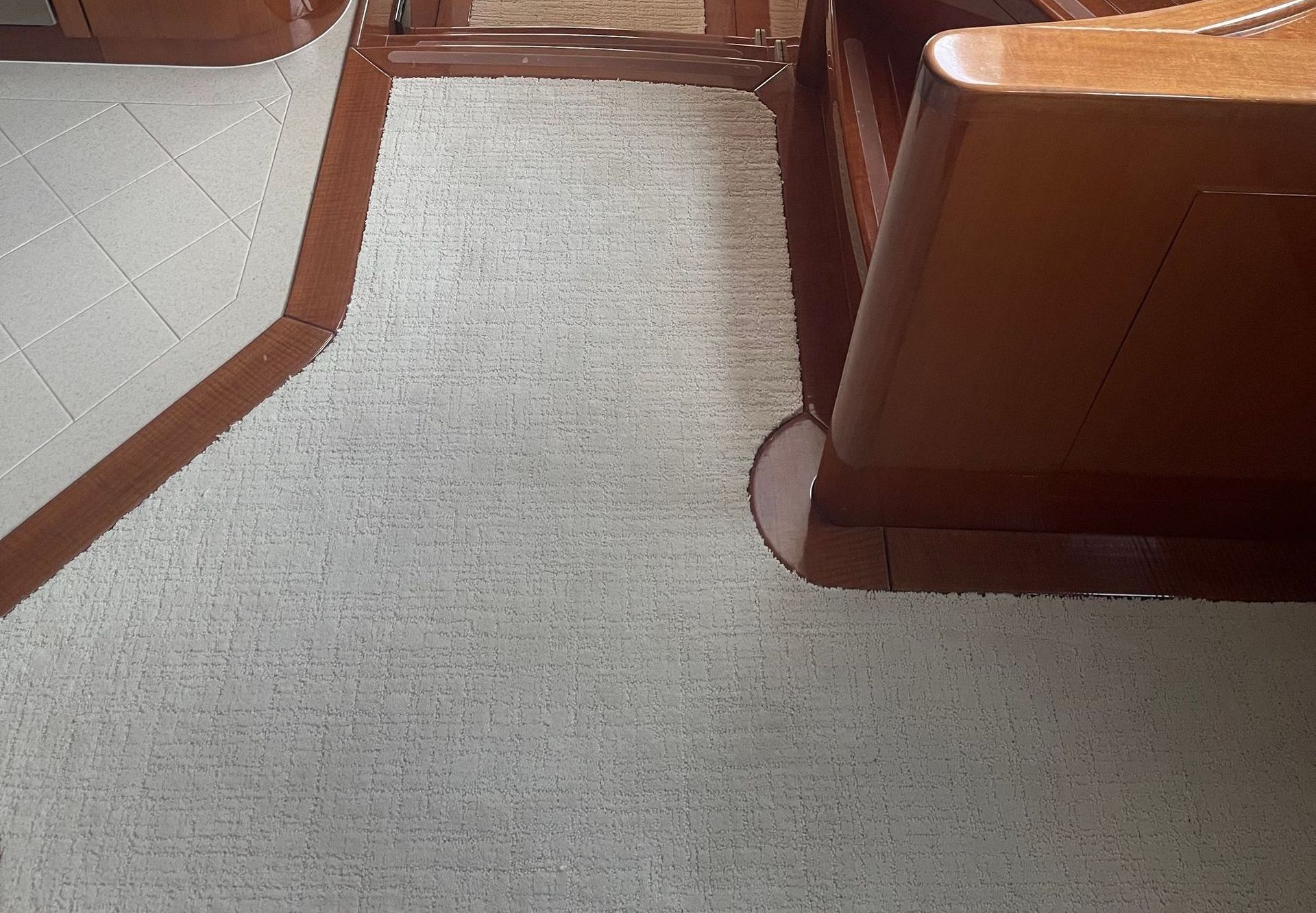 A set of stairs leading up to a boat with a wooden railing