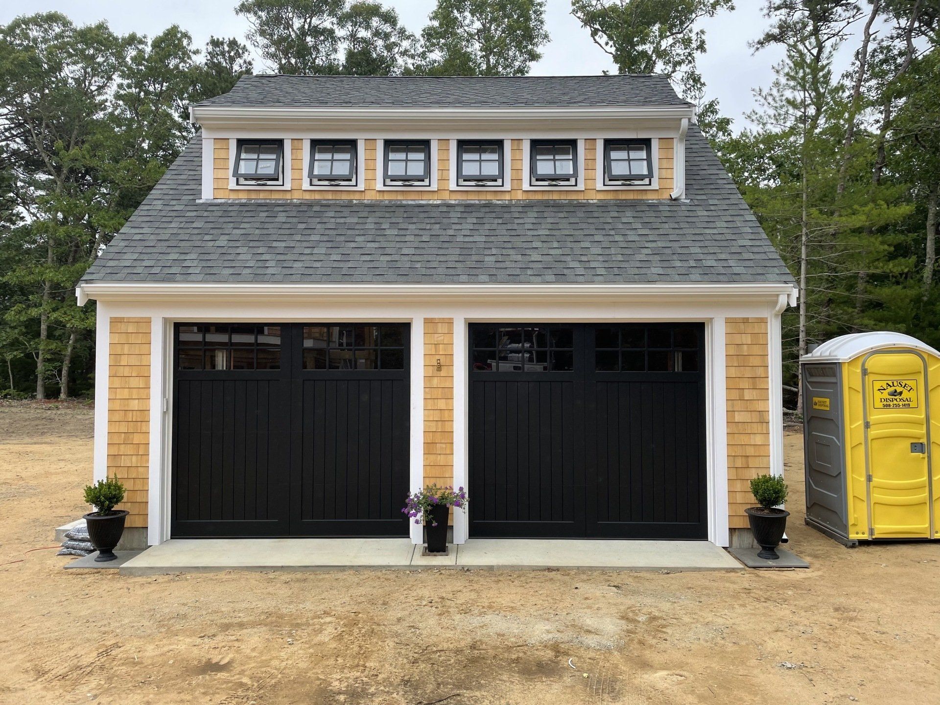 wood composite overlay black double doors front view