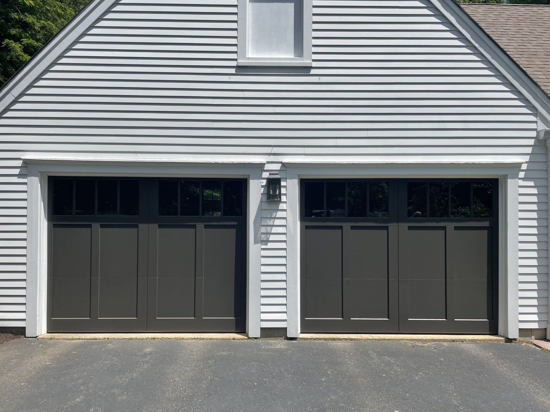 wood composite overlay black double doors front view