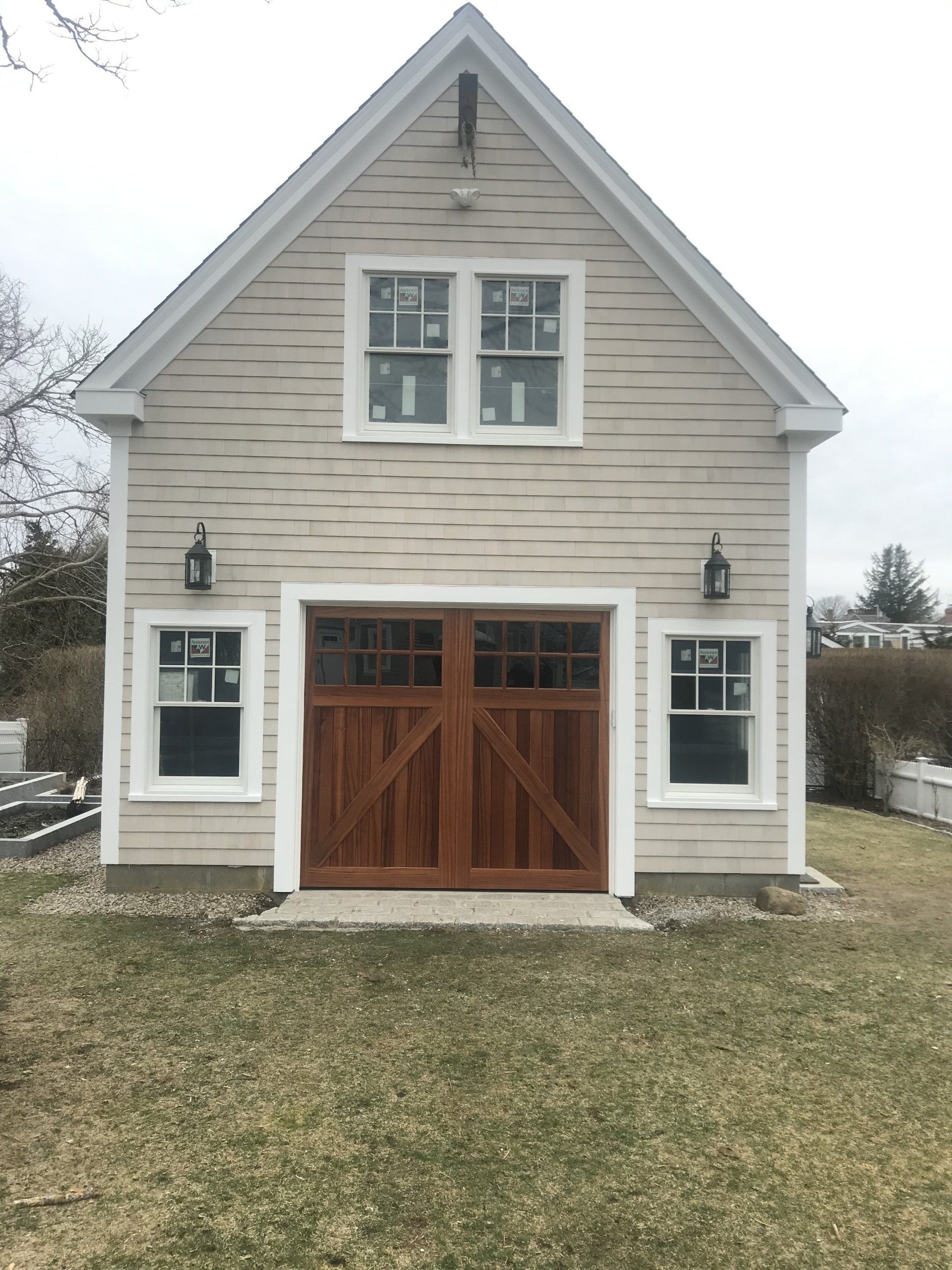 front door wood overlay with double windows on top